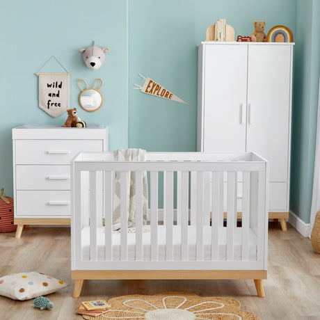 Babymore Mona Mini 3-Piece Nursery Room Set in a nursery with teal-colored walls