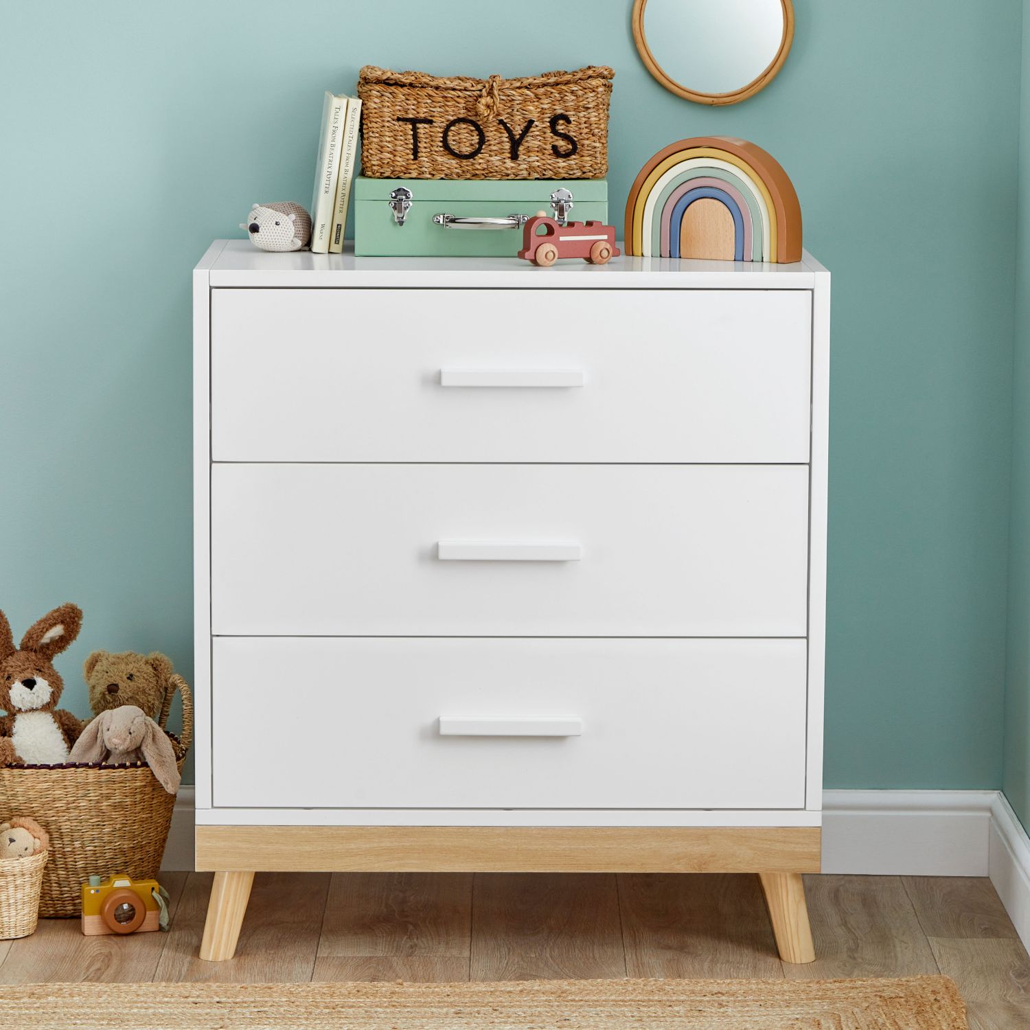 Babymore Mona Nursery Chest of Drawers in White colour with changer top removed and replaced with baby's toys and other nursery decor