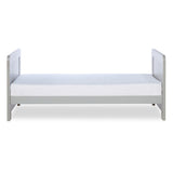 Side profile of Ickle Bubba Pembrey Cot Bed in Ash Grey colour with Fibre Cot Mattress in toddler bed mode