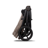 Folded frame of Venicci Claro 3-in-1 Complete Travel System in Almond colour