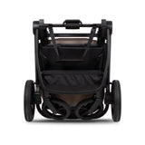 Folded frame of Venicci Claro 3-in-1 Complete Travel System in Almond colour