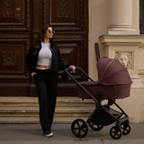 Woman with Venicci Upline 2 Special Edition (SE) Pushchair in Burgundy colour